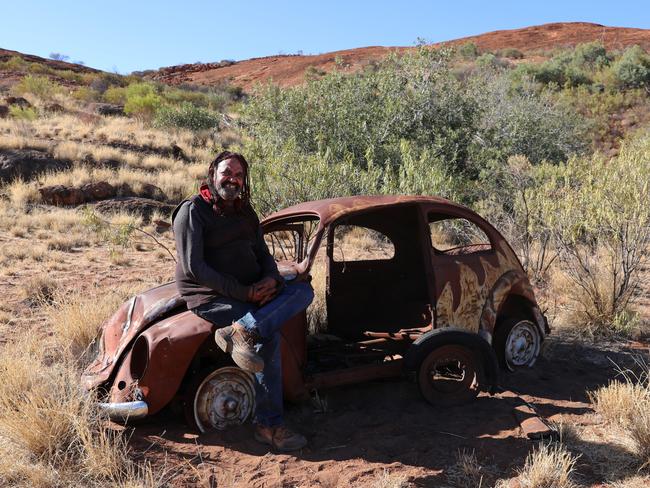 Robert Fielding with his work Mutuka at Mimili in the APY Lands. Picture: Courtesy the artist/Mimili Maku Arts