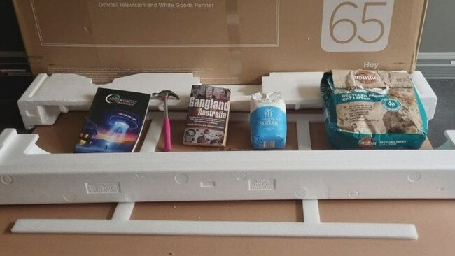 She then opened the box and found a mix of random items, but no TV. Picture: 9News