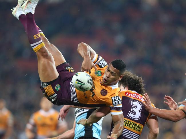 BRISBANE, AUSTRALIA - JULY 26:  Jamayne Isaako of the Broncos is tackled in the air during the round 20 NRL match between the Brisbane Broncos and the Cronulla Sharks at Suncorp Stadium on July 26, 2018 in Brisbane, Australia.  (Photo by Chris Hyde/Getty Images)