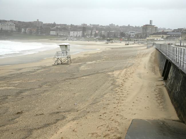 A severe storm still lashing Sydney caused the sand to shift up Bondi Beach. Picture: John Grainger