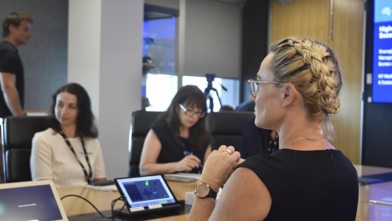 Shenagh Gamble of the Bureau of Meteorology discussing the upcoming wet season with a team of weather experts. Picture: Harry Brill.