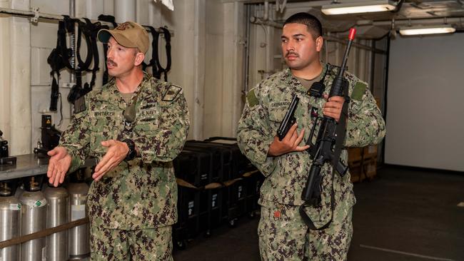 Jesse Whitaker (left) in the Emory S Land’s simulation gun range. Picture: Pema Tamang Pakhrin