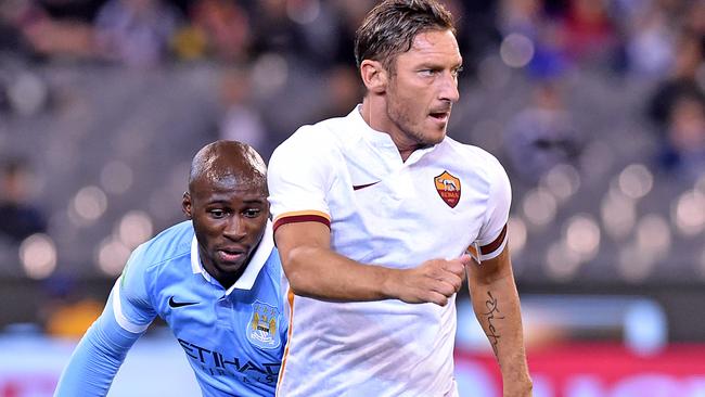 Francesco Totti of AS Roma controls the ball from Eliaquim Mangala of Manchester City, during the second match of the International Champions Cup, between AS Roma and Manchester City, played at the MCG in Melbourne, Tuesday, July 21, 2015. (AAP Image/Joe Castro) NO ARCHIVING