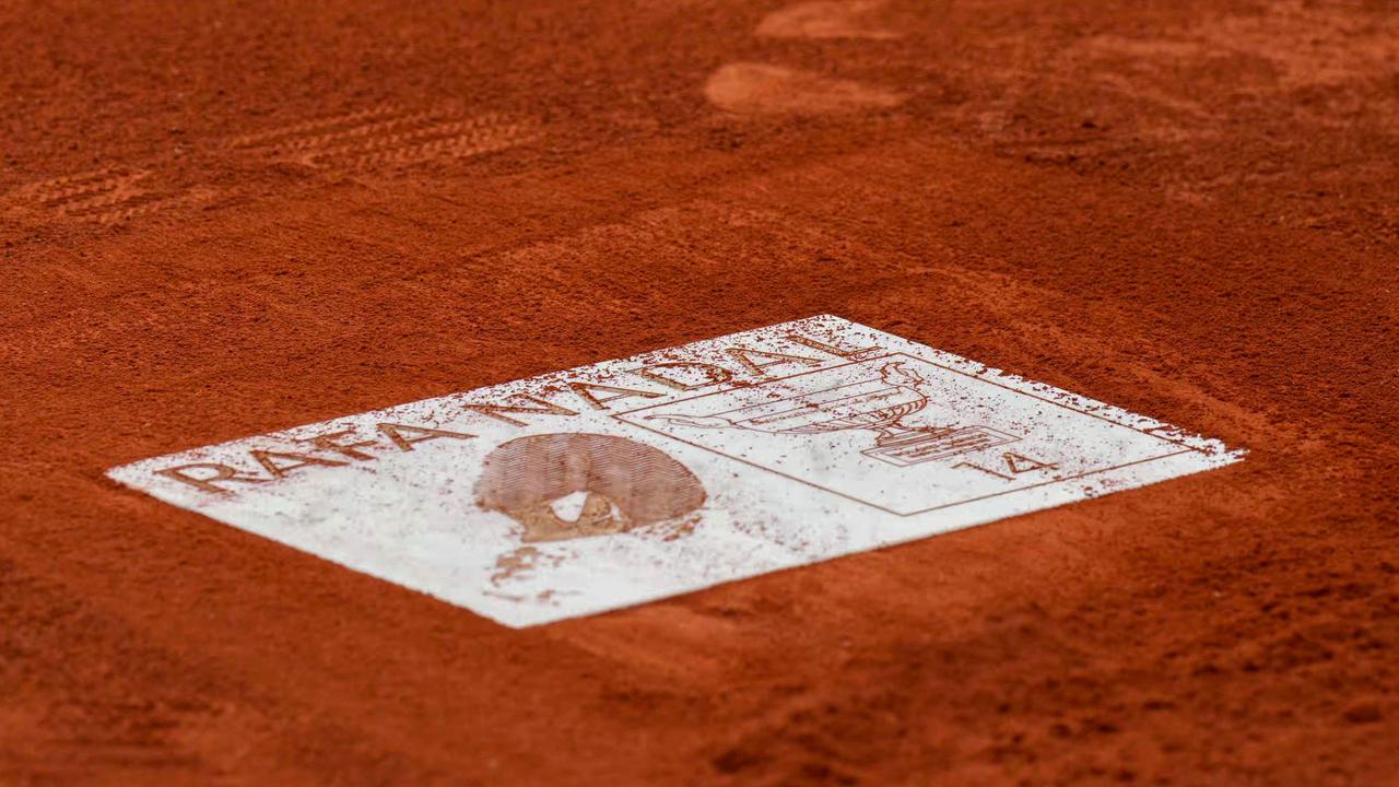 A plate with Nadal’s name and his footprint was unveiled on centre court. (Photo by Dimitar DILKOFF / AFP)