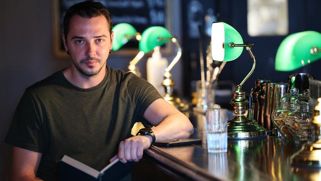 Roman Tazhdynov in his Bibliotheca bar in Adelaide. NCA NewsWire / David Mariuz