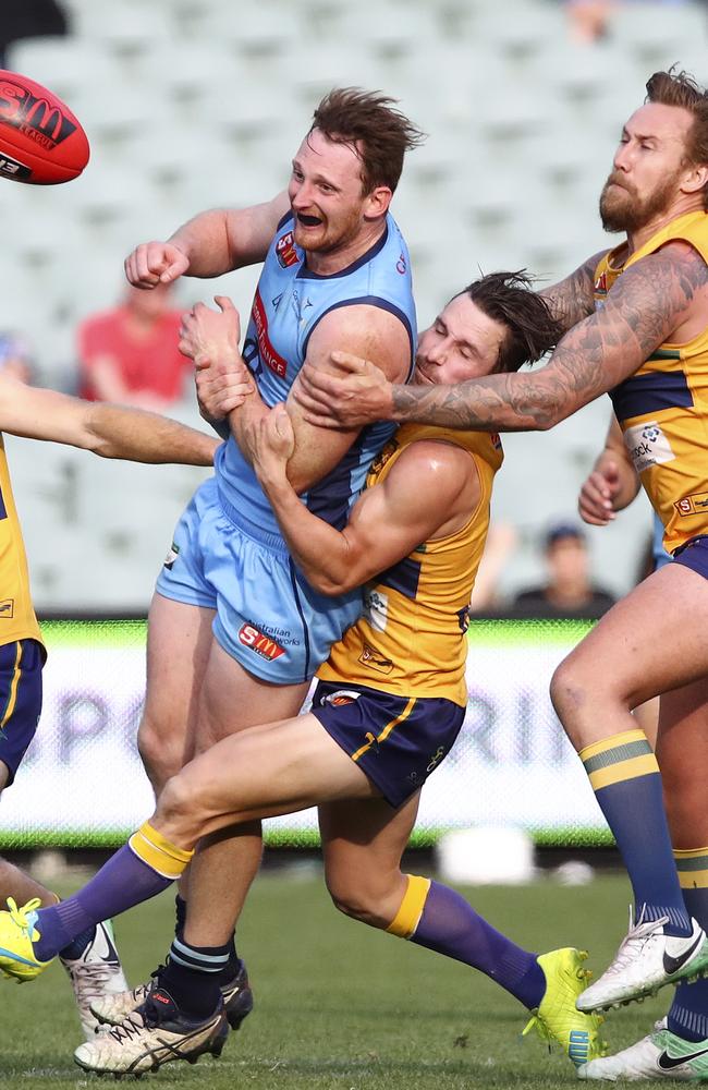 Absolutely fearless, Aidan Riley drives the Sturt engine room with his fierce attack on the body and ball. Picture Sarah Reed