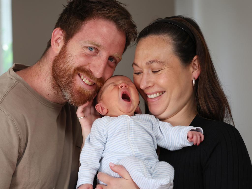 Reece Conca and fiancee Annabelle Grace with son Gio, whose birth ended a heartbreaking four-year journey with infertility. Picture: David Caird