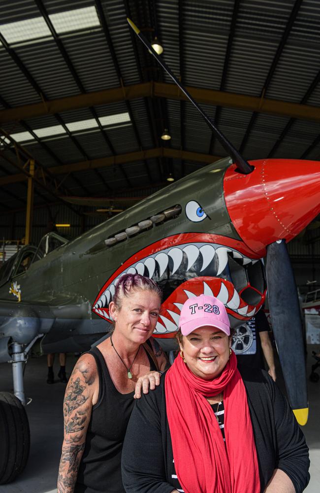 Annamaria Zuccoli (left) and Sarah Jones with a P40 Kittyhawk WWII American that lent air support to the 25th Battalion at Milne Bay on display at the David Hack Classic, Sunday, May 18, 2025. Picture: Kevin Farmer