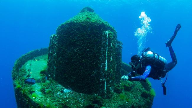 Spectacular shot of a diver at one of the floating buoys, part of the Gold Coast new dive attraction off The Spit.