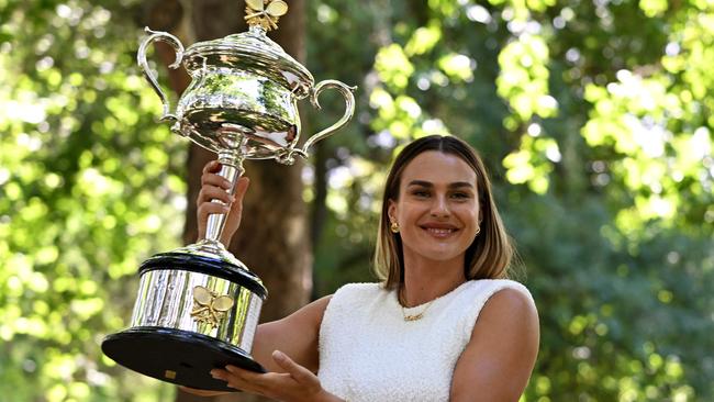 Belarus' Aryna Sabalenka poses with the 2024 Australian Open winner's trophy at Carlton Gardens in Melbourne on Sunday, following her victory over China's Qinwen Zheng.Picture: William West/AFP