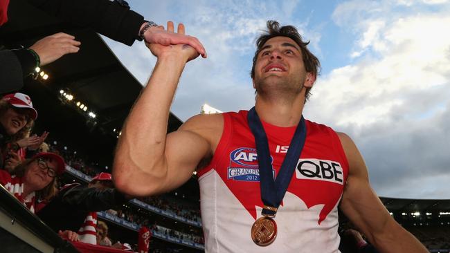 Josh Kennedy, pictured celebrating his 2012 grand final win, says players who don't play the grand final should still be recognised.