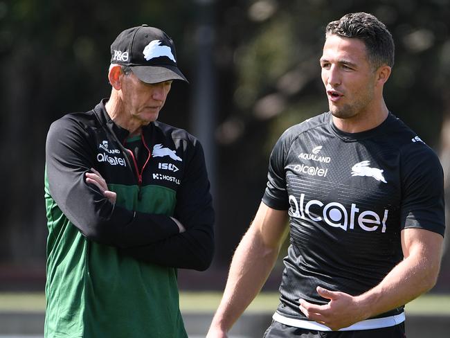 Coach Wayne Bennett soeaks with Burgess during a training session at Redfern Oval. Picture: AAP