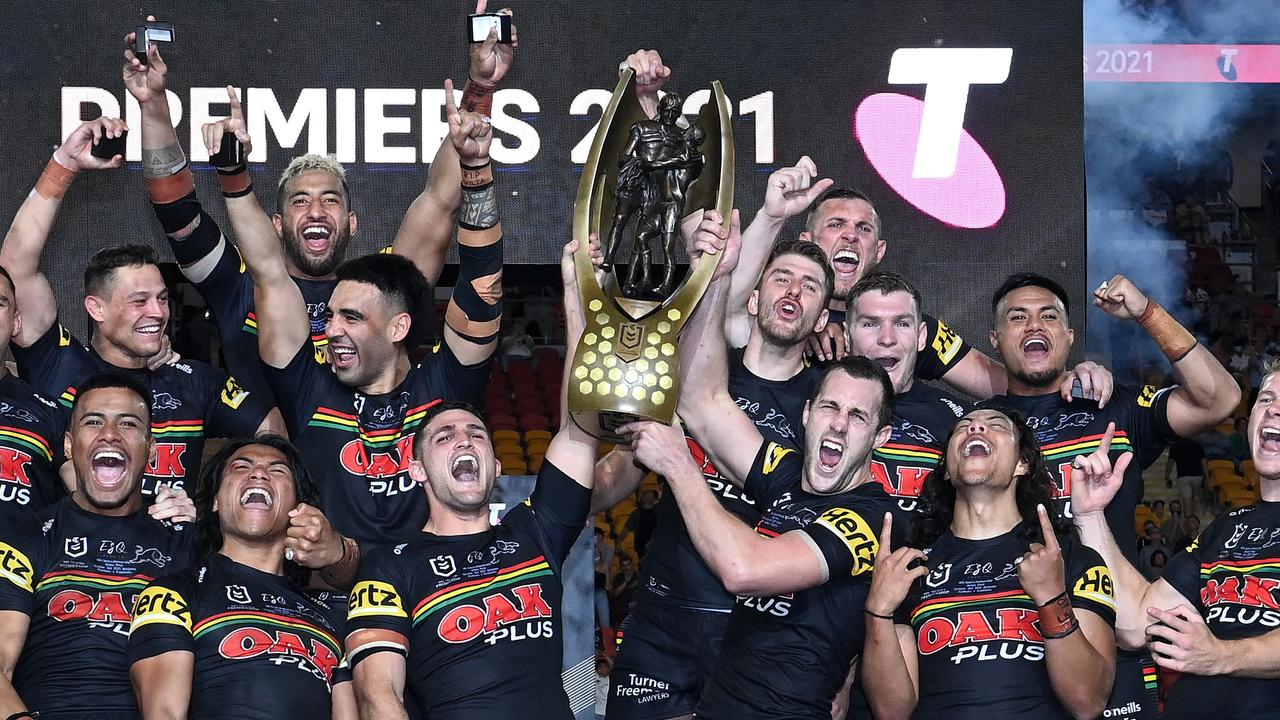 Nathan Cleary and Isaah Yeo hold aloft the premiership trophy after winning the 2021 NRL grand final. Picture: Bradley Kanaris/Getty Images