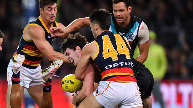 Murphy crunches Darcy Byrne-Jones of the Power on Saturday night. Picture: AAP Image/David Mariuz