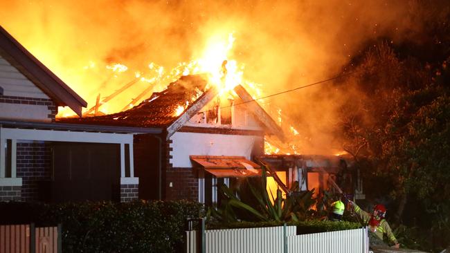 This Five Dock home went up in flames as fiefighters battled to access the property. Picture: Bill Hearne