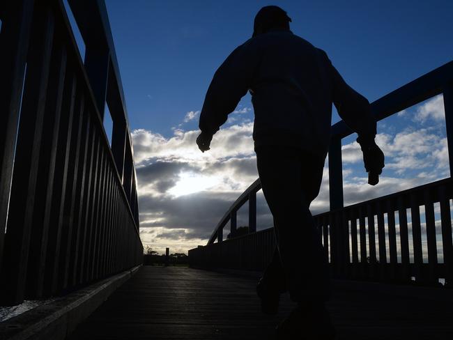 An early morning walker makes his way along the Hobsons Bay Coastal Trail, Seaholme.