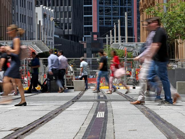 Light rail work continues along George St between Park and Market Streets outside the QVB. Picture: Toby Zerna