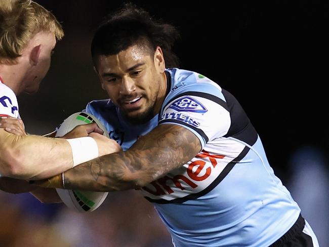 SYDNEY, AUSTRALIA - AUGUST 31: Oregon Kaufusi of the Sharks is tackled during the round 26 NRL match between Cronulla Sharks and New Zealand Warriors at PointsBet Stadium, on August 31, 2024, in Sydney, Australia. (Photo by Cameron Spencer/Getty Images)