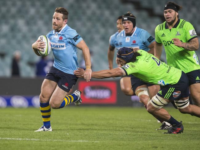 Bernard Foley surges forward for the Waratahs.