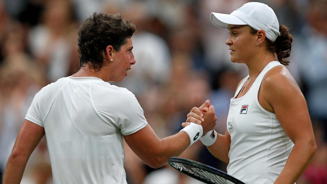 Australia's Ashleigh Barty shakes hands after winning against Spain's Carla Suarez Navarro during their women's singles first round match on the second day of the 2021 Wimbledon Championships at The All England Tennis Club in Wimbledon, southwest London, on June 29, 2021. (Photo by Adrian DENNIS / AFP) / RESTRICTED TO EDITORIAL USE
