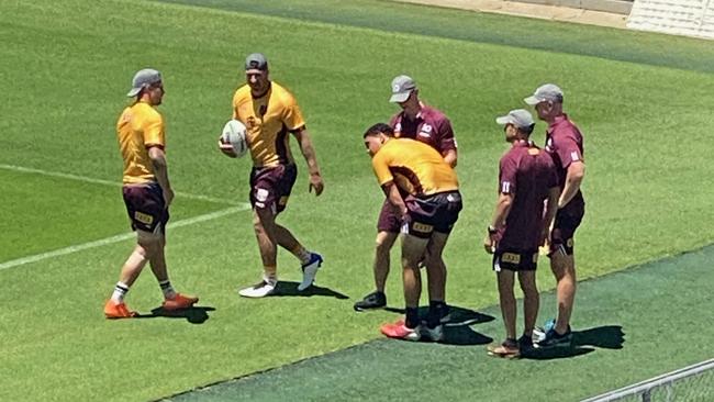 Queensland rookie Xavier Coates bends over in pain after injuring his shoulder on the Gold Coast