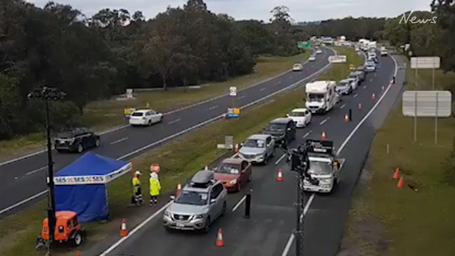 Queensland border queues build minutes before reopening (7 News)