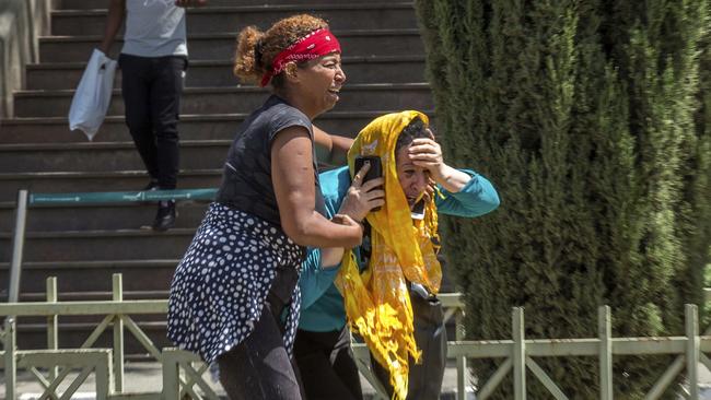 Distraught family members of the victims involved in the plane crash. Picture: AP