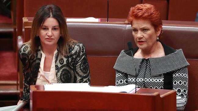 Senator Jacqui Lambie with Pauline Hanson before the vote on the Ensuring Integrity Bill in the Senate chamber. Picture: Gary Ramage