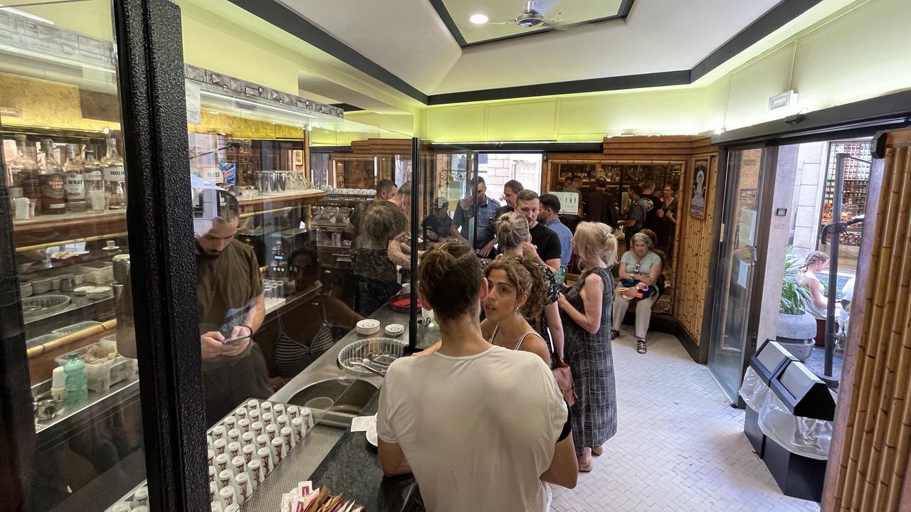 Locals have their coffee and croissants standing up.