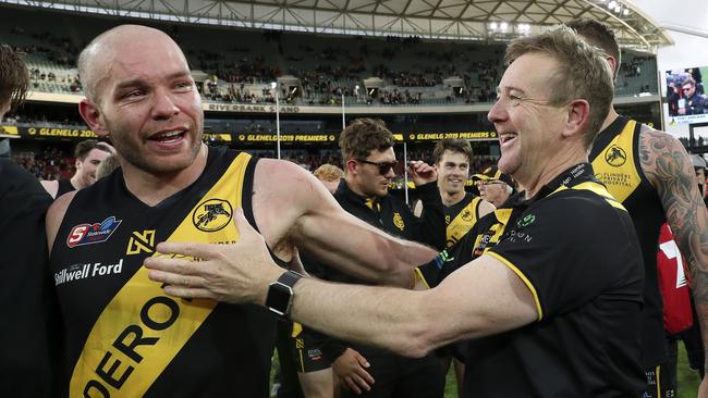 Mark Stone celebrates the drought-breaking grand final triumph over Port Adelaide with Aaron Joseph. Picture: Sarah Reed