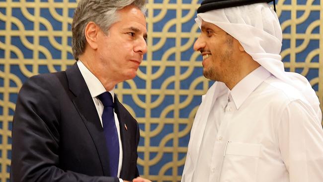 Qatar's Foreign Minister Sheikh Mohammed bin Abdulrahman bin Jassim al-Thani (R) shakes hands with US Secretary of State Antony Blinken during a joint press conference in Doha on June 12, 2024. (Photo by Ibraheem AL-OMARI / POOL / AFP)