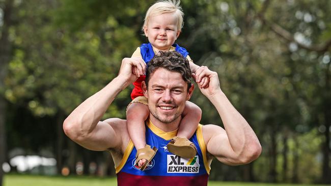 Brisbane Lions player Lachie Neale with daughter, Piper. Picture: Zak Simmonds.