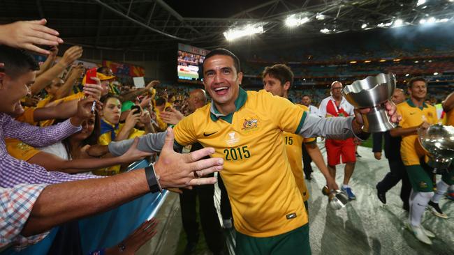 Tim Cahill laps it up with fans.