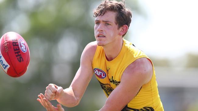 Riley Collier-Dawkins handballs during a Richmond training session at Southport Sharks on the Gold Coast. Picture: Chris Hyde/Getty Images