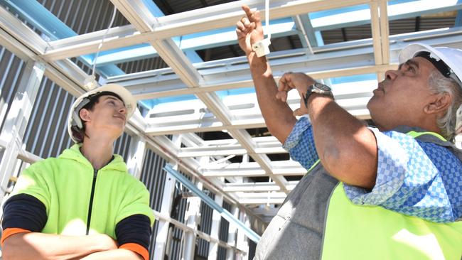 Inspecting work on the new Manjali Studio School that will be located in the southern West Kimberley of Western Australia is (from left) Hutchinson Builders Toowoomba apprentice Blake Hicks and Bunuba Dawangarri Aboriginal Corporation director Kevin Oscar.