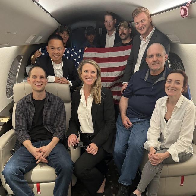 US journalist Evan Gershkovich (L), former US Marine Paul Whelan (2R) and US-Russian journalist Alsu Kurmasheva (R) are seen on a plane after their release from Russia on August 1, 2024. Gershkovich, Whelan, Kurmasheva and Russian opposition activist Vladimir Kara-Murza were part of a 24-prisoner swap with Russia. Picture: US Government/AFP