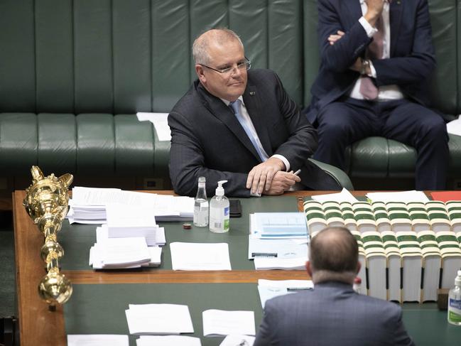 Prime Minister Scott Morrison with Leader of the Opposition Anthony Albanese during Question Time in the House of Representatives in Parliament House in Canberra. Picture Gary RamageA reduced number of politicians in the House of Representatives during Question Time at Parliament House in Canberra. Picture Gary Ramage