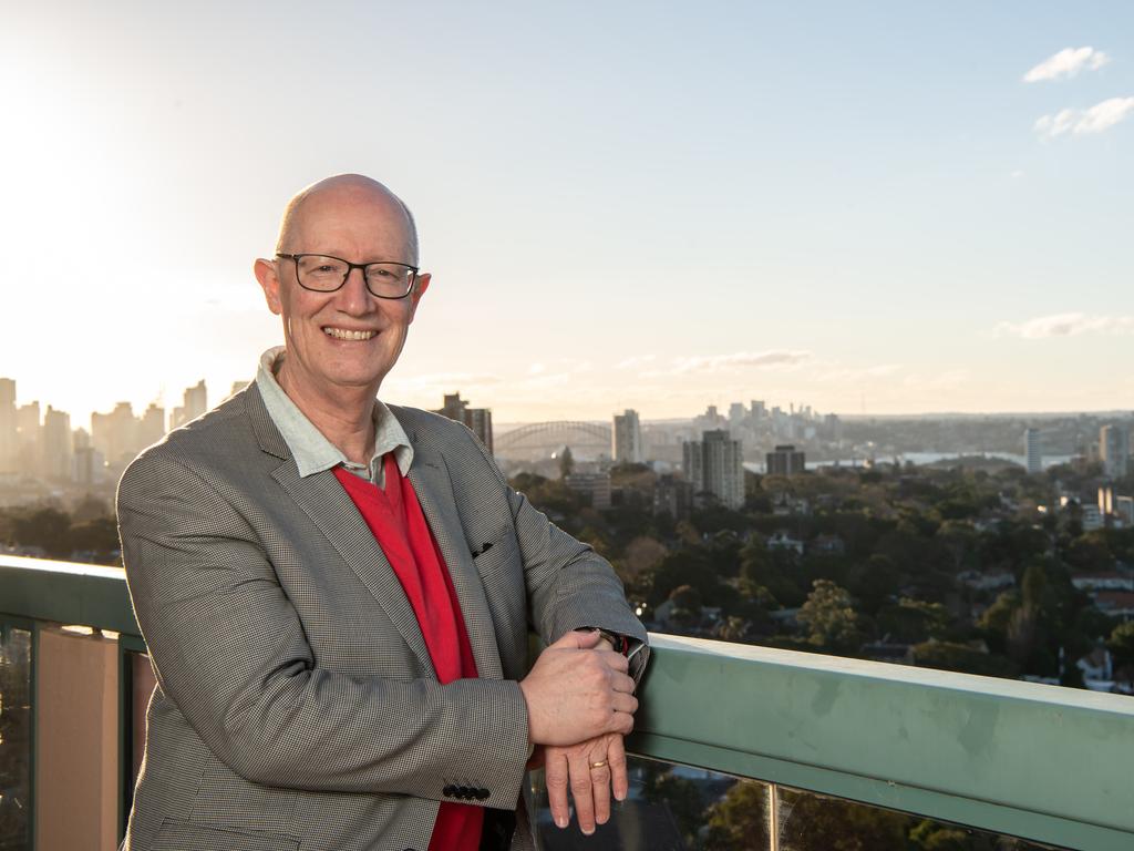 Former solicitor and headmaster turned thriller novelist Gilbert Mane on the balcony of his late mother’s penthouse, which sold for $2.7 million at auction. Picture: Monique Harmer.