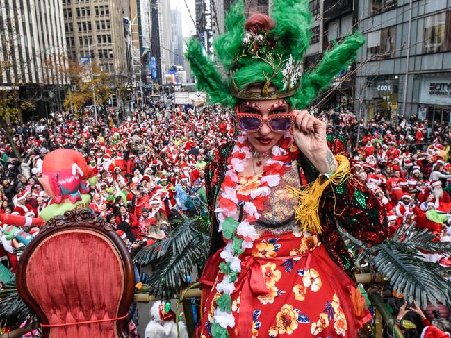 Revellers dressed as holiday characters participate in the annual SantaCon pub crawl in New York City. Picture: Stephanie Keith/Getty Images