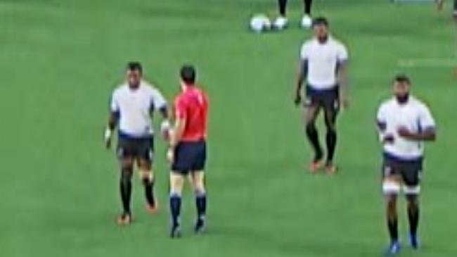 New Zealand referee gives a low-five to a Fijian after they scored and went out to a 21-12 lead over the Wallabies.