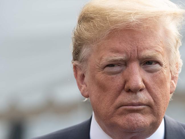 (FILES) In this file photo taken on June 08, 2018 US President Donald Trump speaks to the press before departing the White House for the G7 summit in Washington, DC, on June 8, 2018. Trump announced on June 15, 2018 a series of tariffs of 25 percent targeting $50 billion in Chinese imports from "industrially significant" technologies, making good on a pledge to punish the alleged theft of American intellectual property. In a statement, Trump also warned of "additional tariffs" should China retaliate with countermeasures on American goods and services exports.  / AFP PHOTO / NICHOLAS KAMM