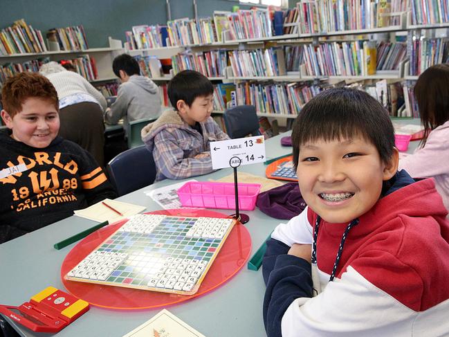 Jason Tang 12-years posing at the Scrabble tournament is being held at Cabramatta Primary School in Cabramatta NSW, Australia. 12 August, 2018. A scrabble tournament is being held to raise money for Jason Tang, a 12-year old who will be flying to Dubai to compete in the world scrabble youth championship, where he'll be taking on people five years older.  (IMAGE / Carmela Roche).