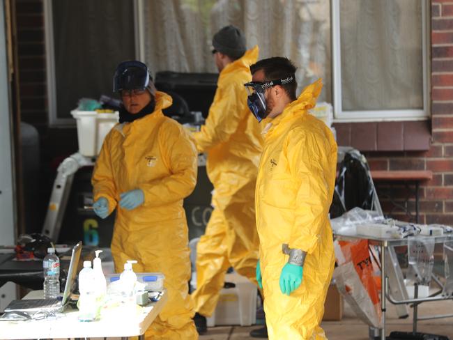 Crime scene officers dismantle and examine the drug laboratory at Morphett Vale. Picture: Tait Schmaal