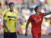 Simon Makienok of Brondby (L) and Daniel Agger of Liverpool walk on the pitch on July 16, 2014 at Broendby stadium suringa test match between Brondby and Liverpool. Broendby won 2-1. AFP Photo / / Scanpix DENMARK / Liselotte Sabroe / DENMARK OUT