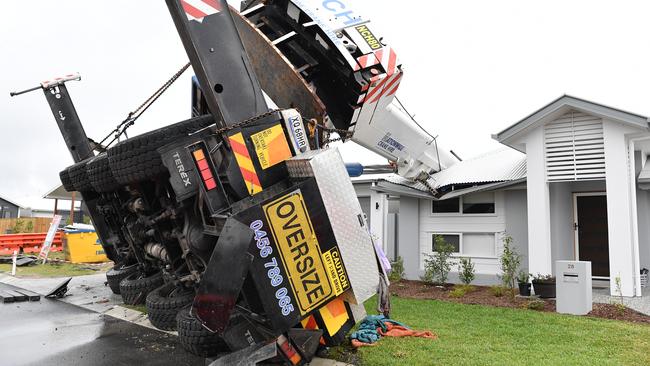 Three houses were damaged when a crane toppled over at Nirimba on Friday afternoon. Picture: Patrick Woods.