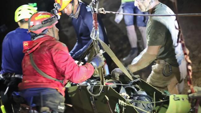 One of the boys is moved on a stretcher during a rescue operation inside the Tham Luang cave.