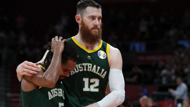 BEIJING, CHINA – SEPTEMBER 13: Aron Baynes with Patty Mills of Australia reacts after lose the game against Spain during the semi-finals of 2019 FIBA World Cup match between Spain and Australia at Beijing Wukesong Sport Arena on September 13, 2019 in Beijing, China. (Photo by Lintao Zhang/Getty Images)