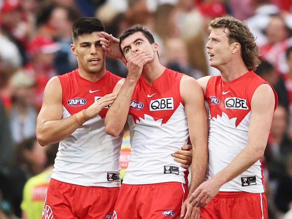 Teammates console Logan McDonald (centre) after the game. (Photo by Matt King/AFL Photos/via Getty Images)