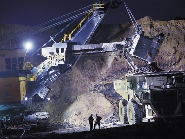 Heavy machinery operates in a coal mine owned by Wesfarmers Ltd. in Collie, Western Australia, in this undated photograph. Photographer: Evan Collis/Bloomberg News.