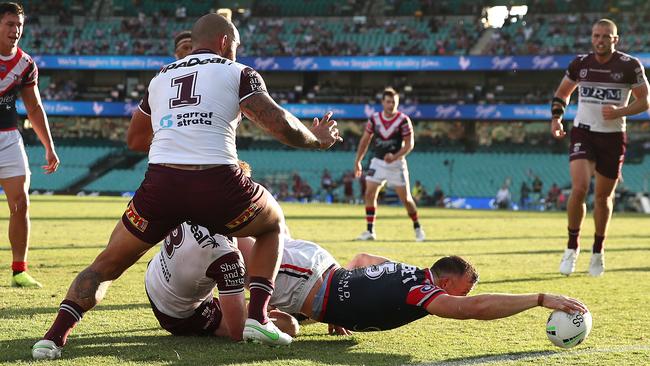 Brett Morris of the Roosters reaches out to score the first of his three tries for the night. Picture: Cameron Spencer/Getty Images